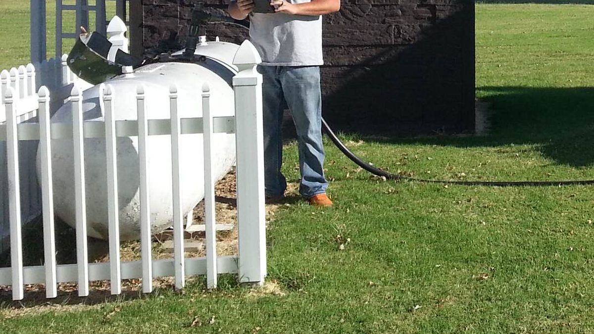 Propane delivery truck at a customer home